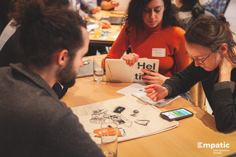 Testessen participant takes notes while watching a user test.